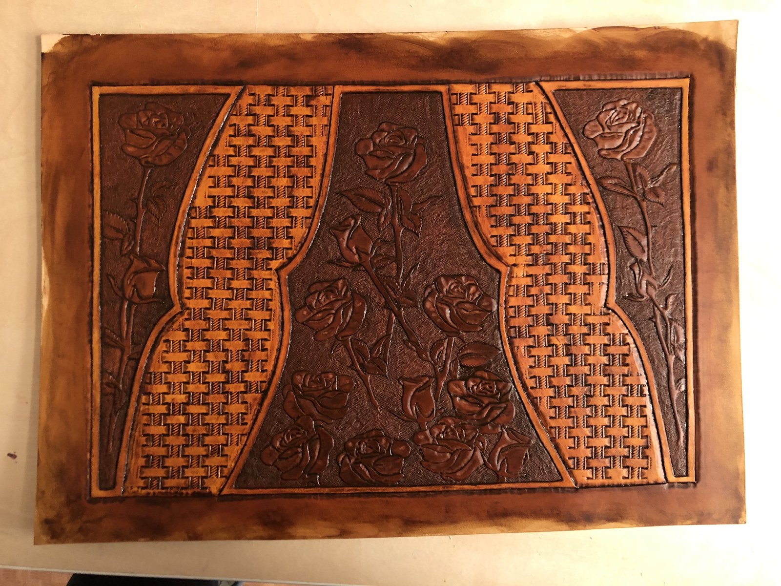 Hand-dyeing carved leather panels