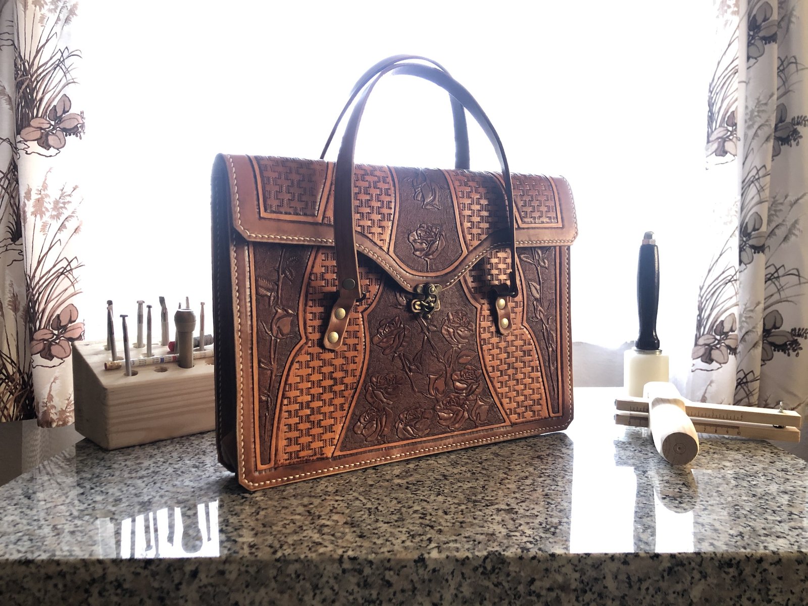 Finished hand-stitched leather satchel